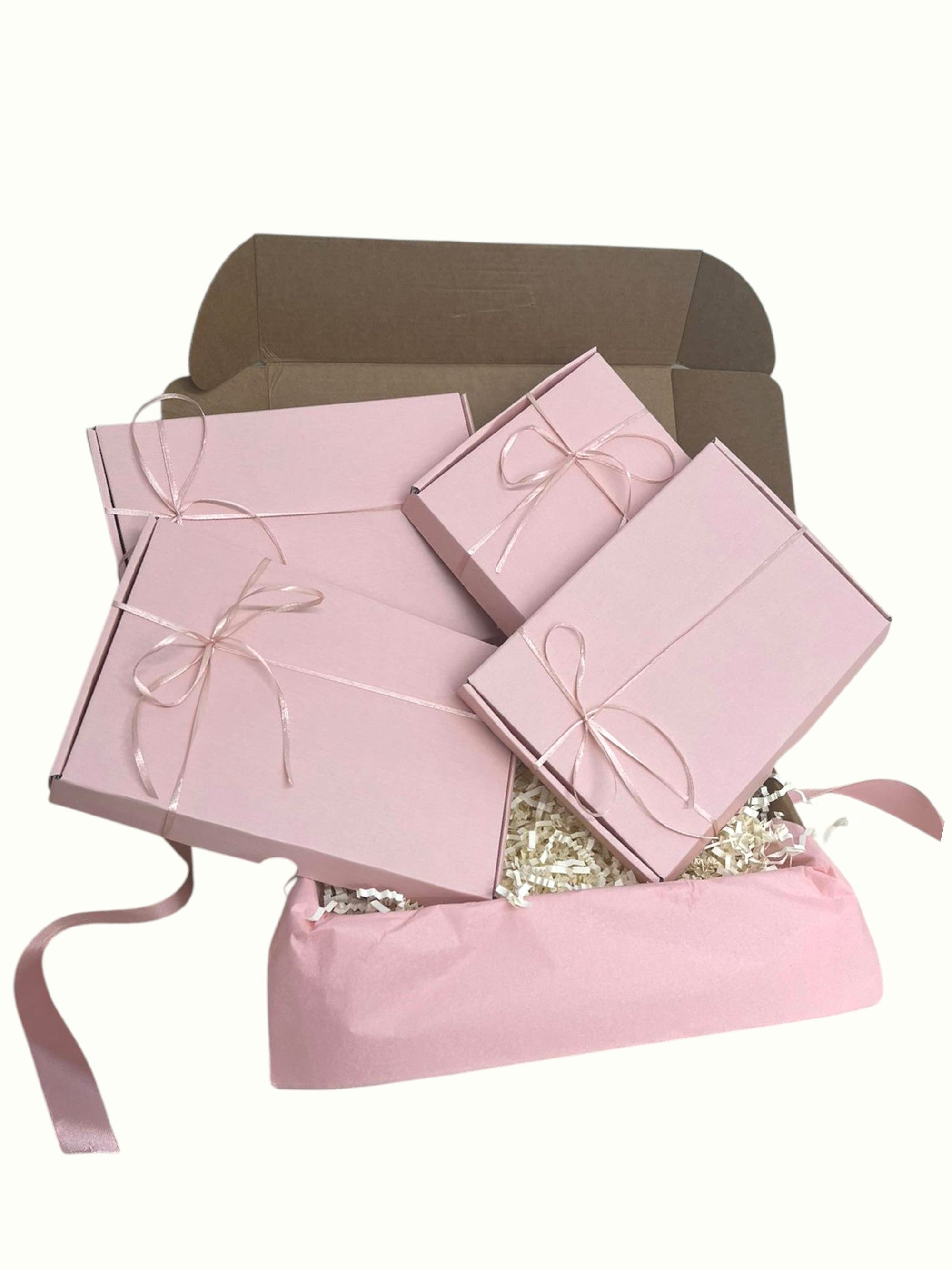 4-in-1 hamper box with 4 mini gift boxes containing skincare gifts and treats, perfect for Christmas or birthday pamper gifts