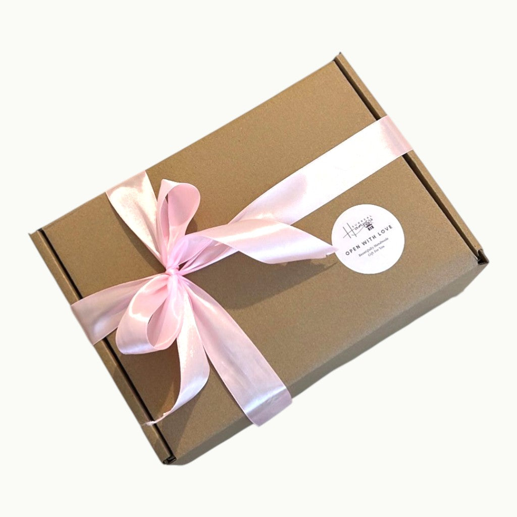 Brown gift box with a pink ribbon Surreal Hampers UK