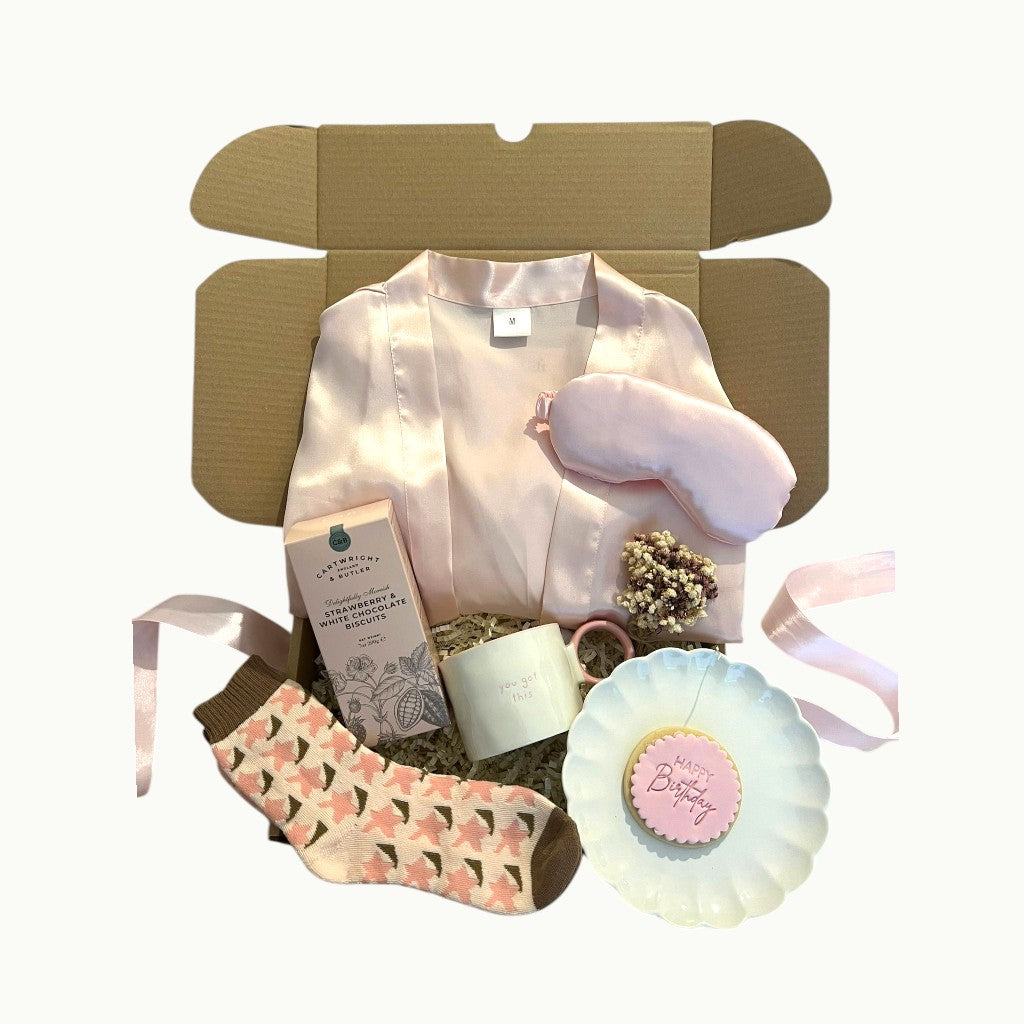 Self care gift box UK with satin robe, cosy socks, sweet treats and mug, perfect pamper hamper gift for her