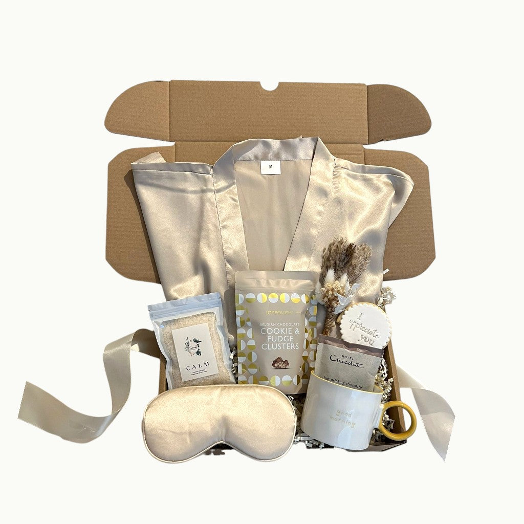 Cosy night in gift box with satin robe, hot chocolate, sweet treats and self care essentials
