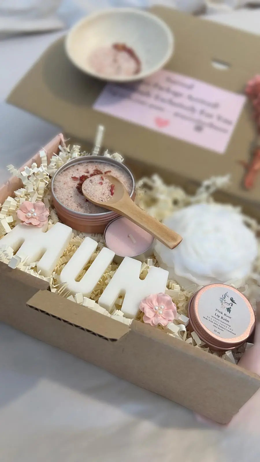 Luxury Christmas gift box for women with bath salts, candles, and holiday treats