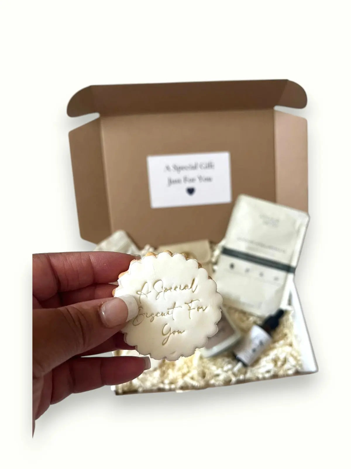 Relaxation gift box with skincare oil, cookies, candle, and mask. FREE next day delivery