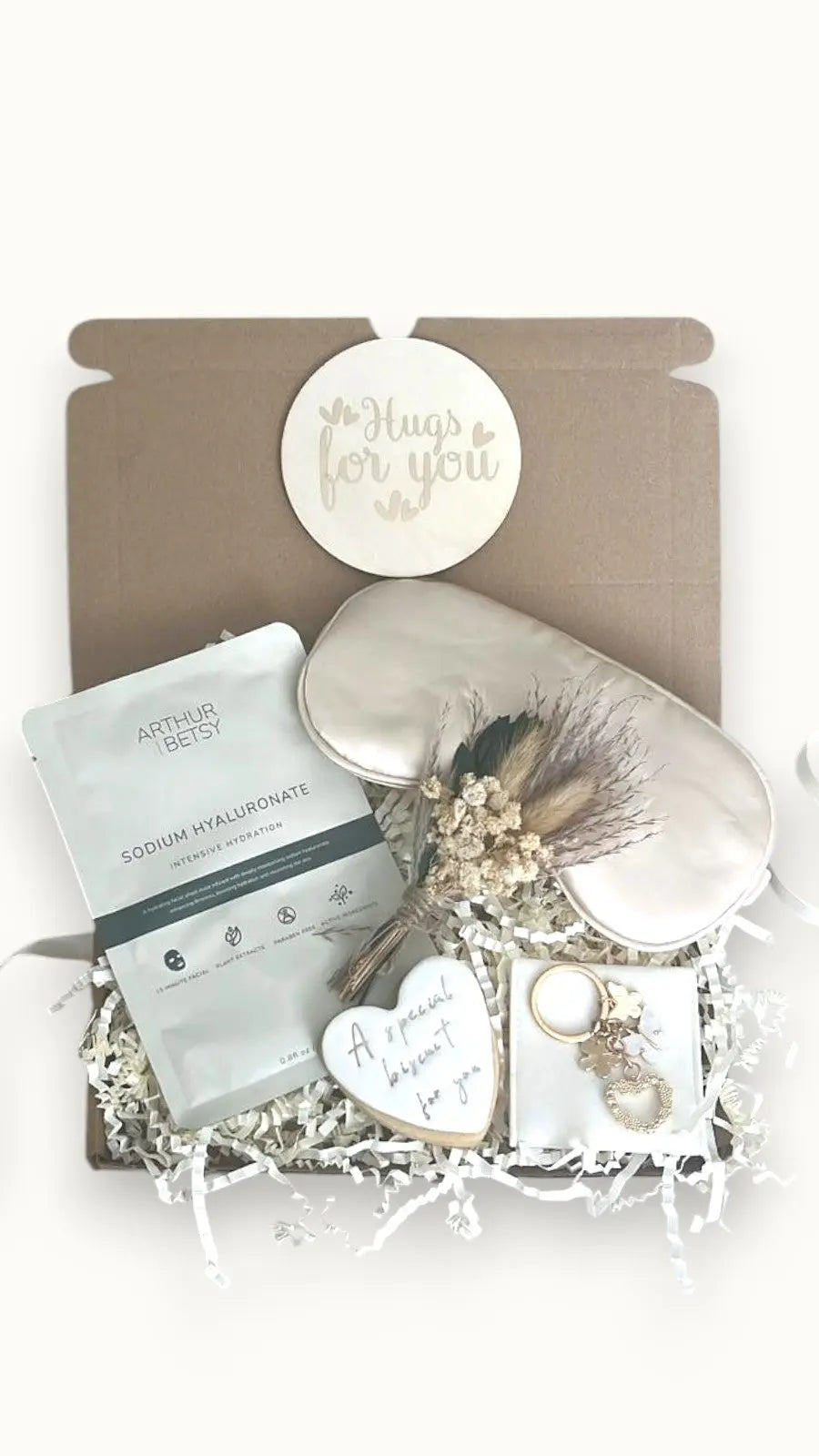 Self-care gift box with You’ve Got This Hugs packaging, bath products, and pampering items
