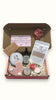 Personalised Gift set with various items including a tealight candle, rose clay mask, rose geranium biscuit and lip balm Surreal Hampers UK