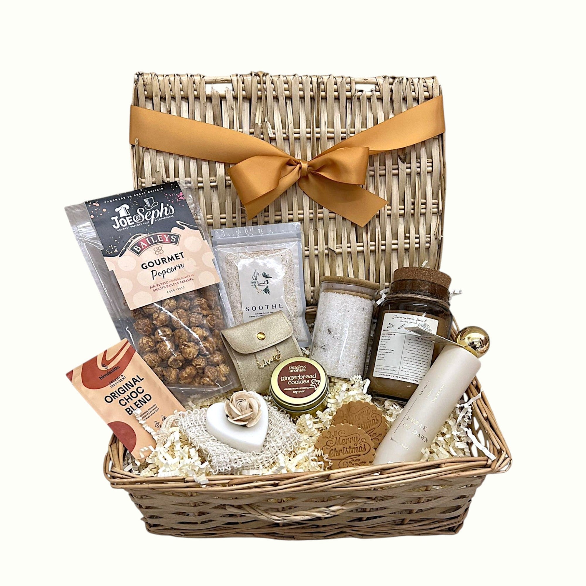 Luxury Christmas gift hamper basket with Baileys popcorn, festive candle, hot chocolate, soap with exfoliating bag, love heart jewellery, Christmas cookies, bath salts, and soothing bath soak, perfect pamper gift for her