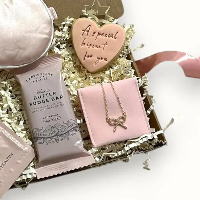 Custom gift box with personalised message, skincare items, and indulgent treats for her