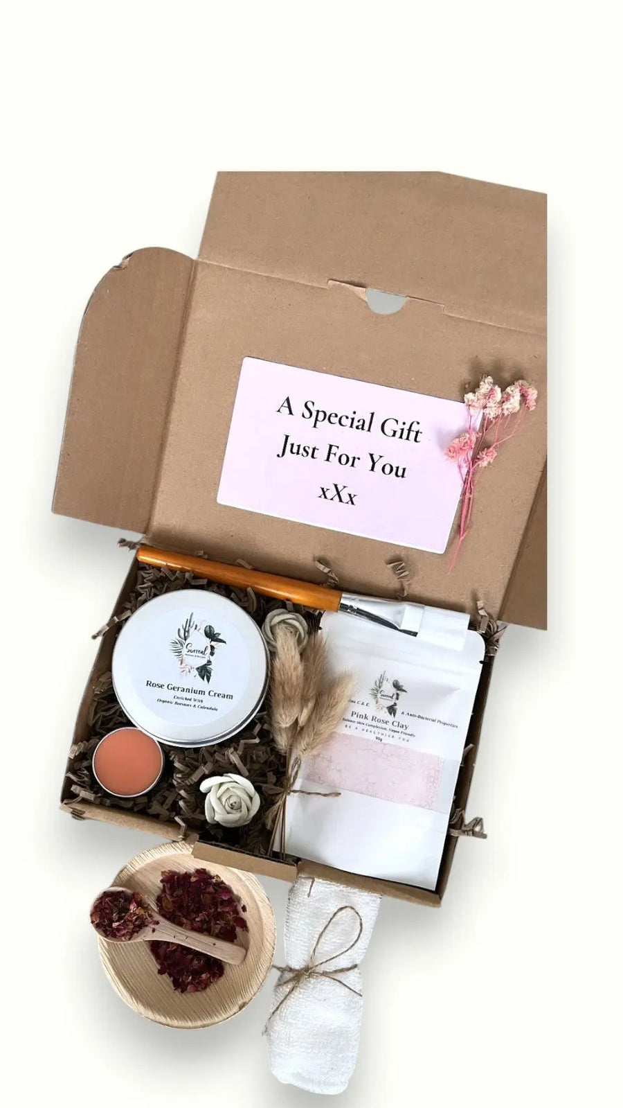 Self-care gift box featuring natural skincare items, rose geranium cream