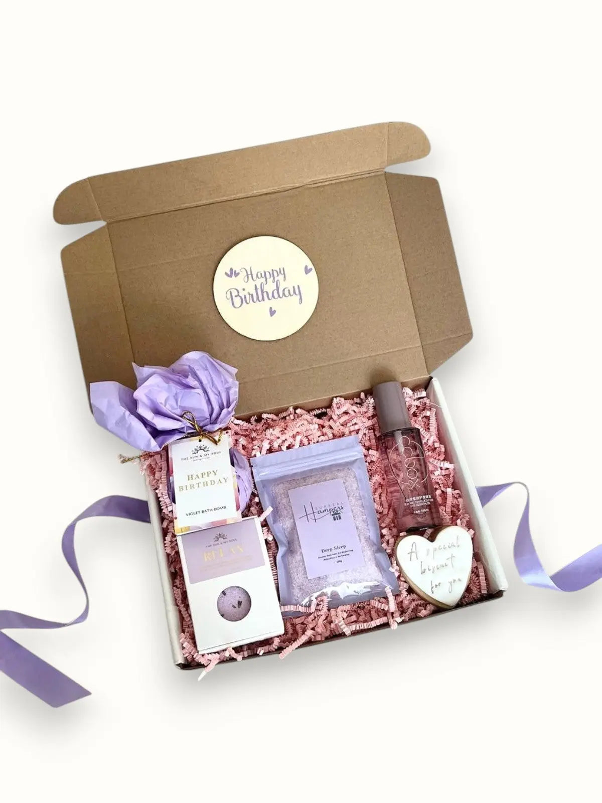 A gift box with bath salts hair oil biscuit and bath bomb 'Happy Birthday' Surreal Hampers UK