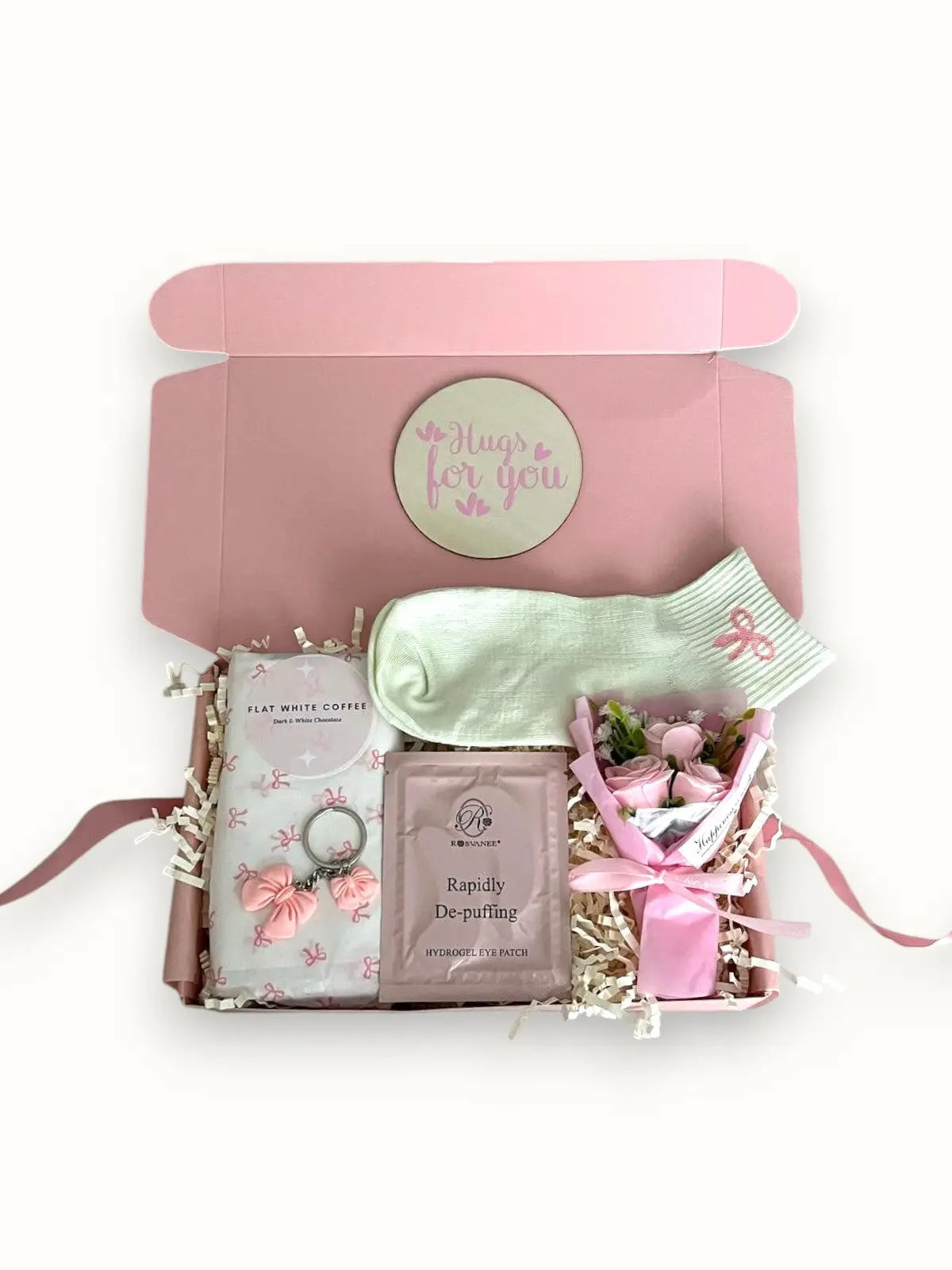 Pink thinking of you gift box with a variety of items including a cosy socks, chocolates, mini dried flowers