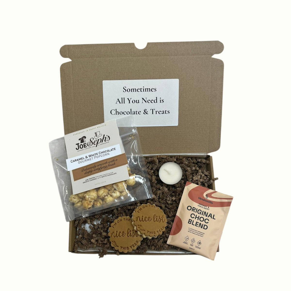 Chocolate and treats gift set with a candle, Christmas cookies, hot chocolate sachet and pop corn Surreal Hampers UK