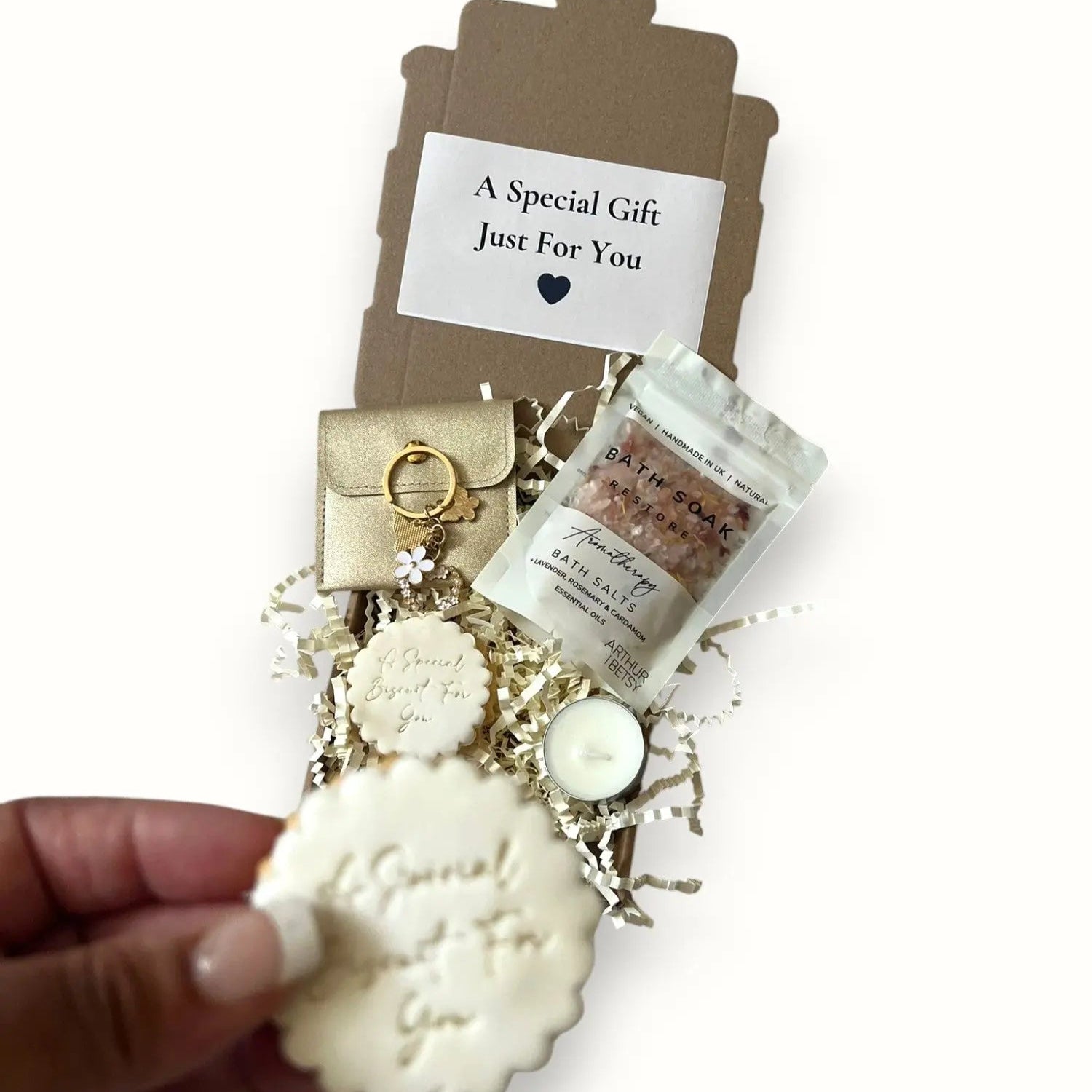 Thoughtful mini gift box with cookies, keyring, and bath salts for birthdays