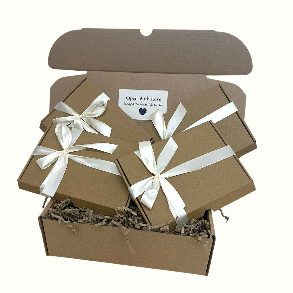 Surreal Hampers Christmas and birthday pamper gift box for her, 4-in-1 hamper with natural cream, lip balm, bath salts, and candle — perfect for self-care nights and girls’ night in gifts UK.