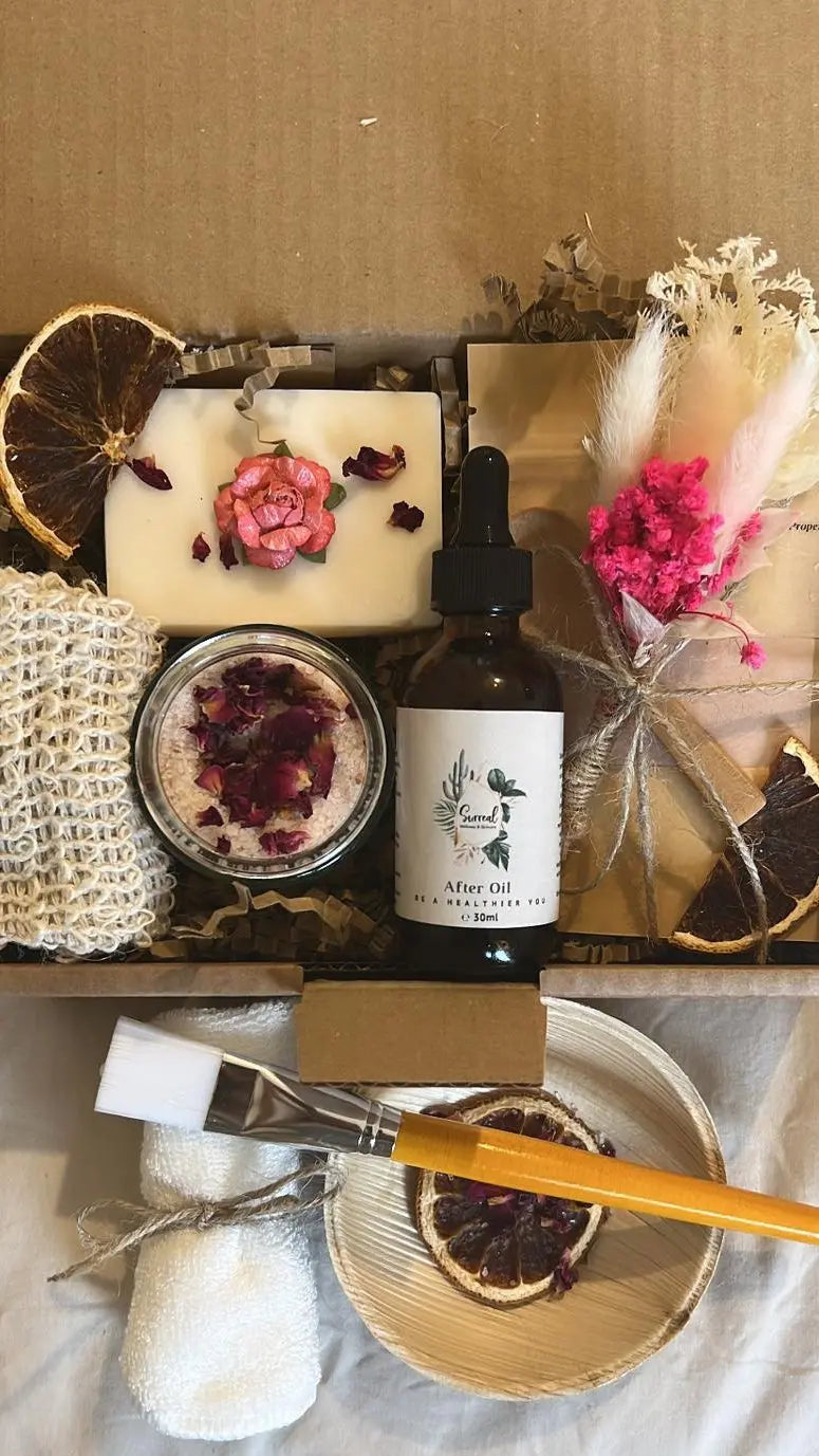 Customized Christmas hamper box with natural skincare essentials including bath salts, natural vegan soap, pink clay mask and oil