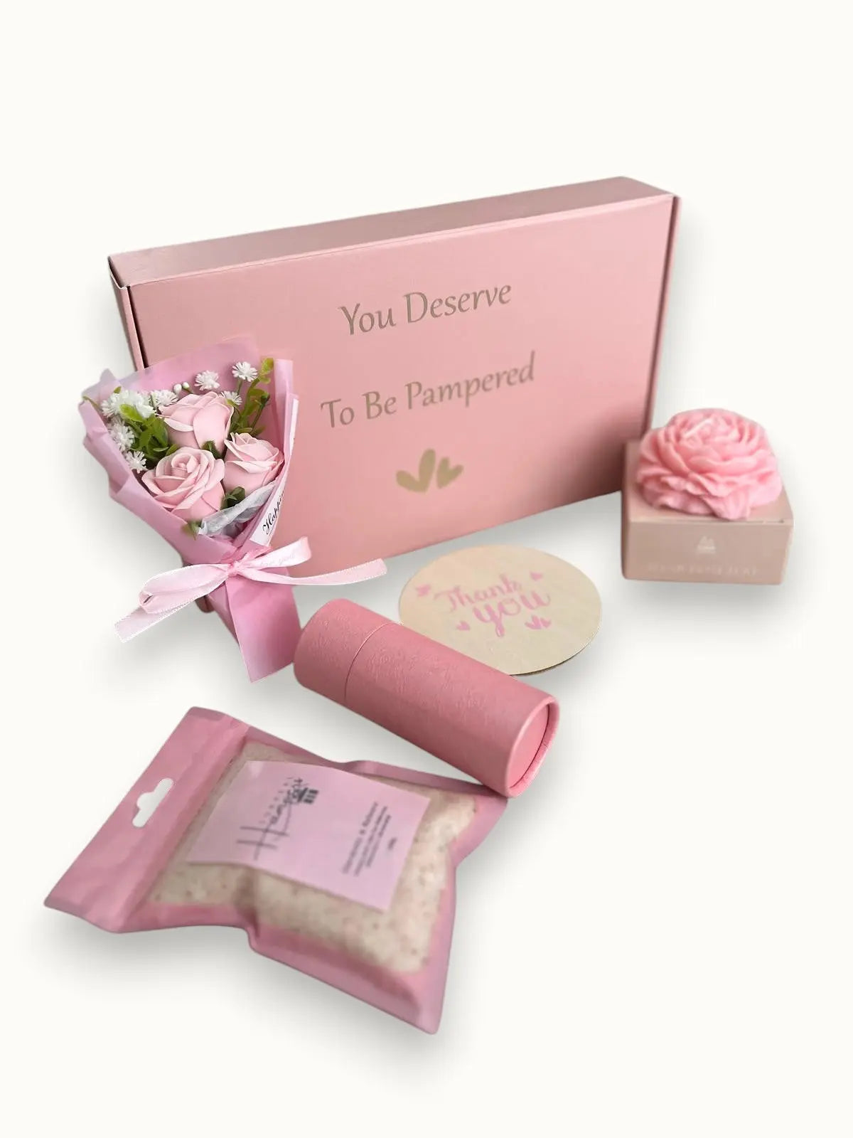 Self-care gift set with face mask, oil, cookies and relaxing candle