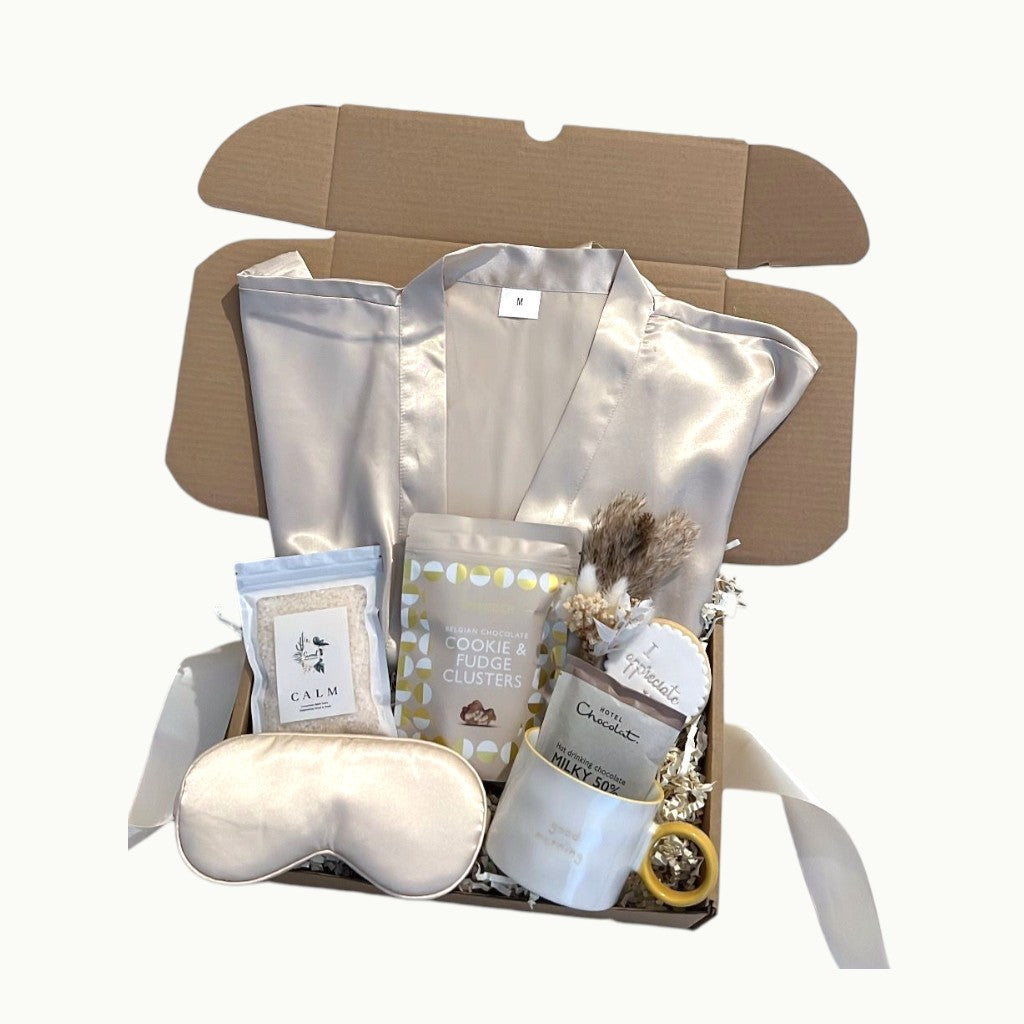 Cosy pamper gift set with satin robe, calming bath salts, chocolate treats and personalised cookie