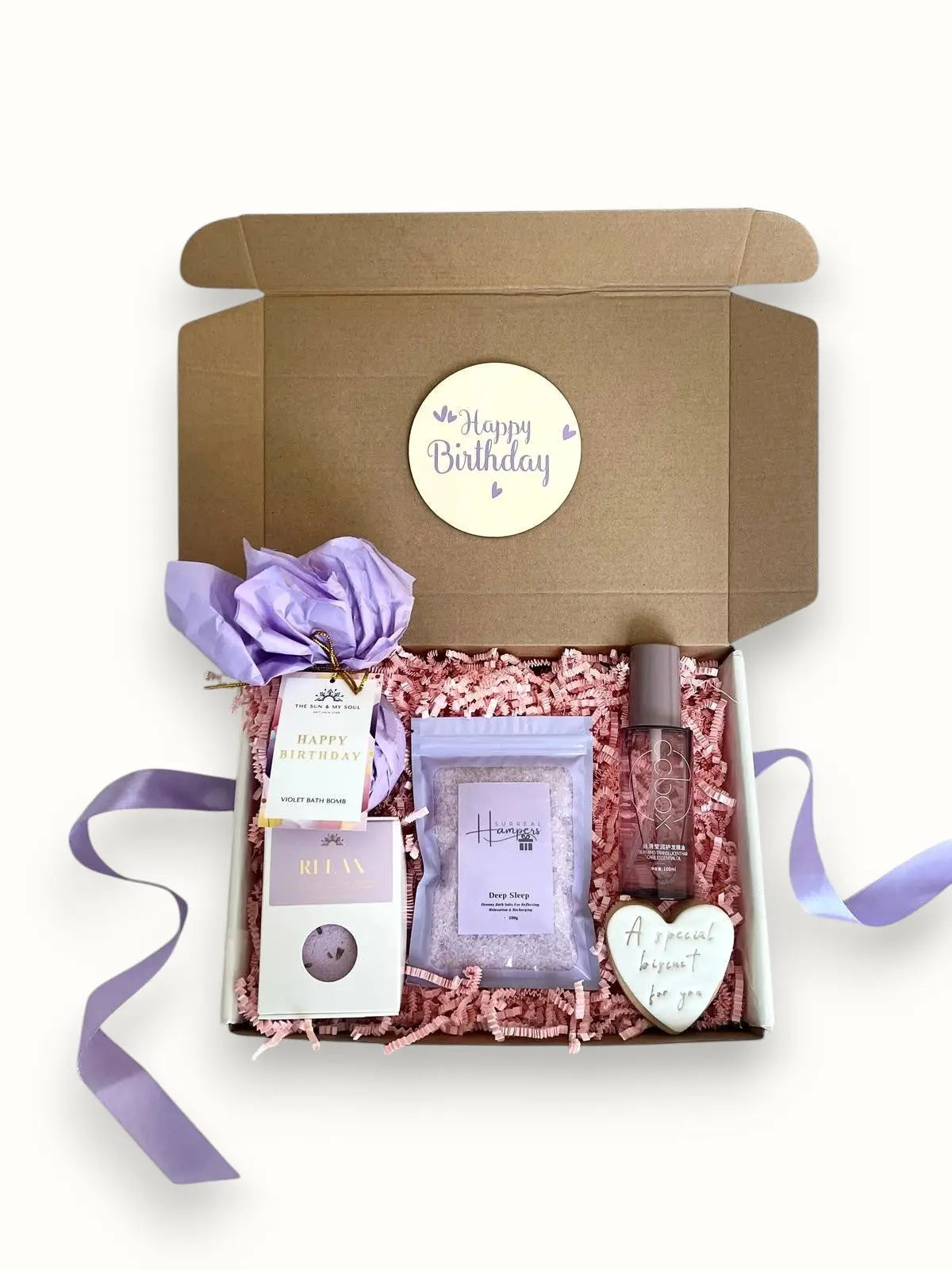 A gift box with bath salts hair oil biscuit and bath bomb 'Happy Birthday' Surreal Hampers UK