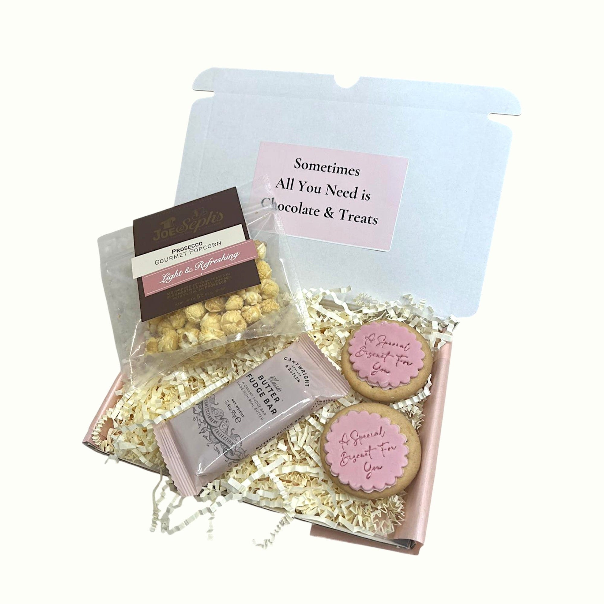 Self-care hamper with 4 mini gift boxes including skincare and treats